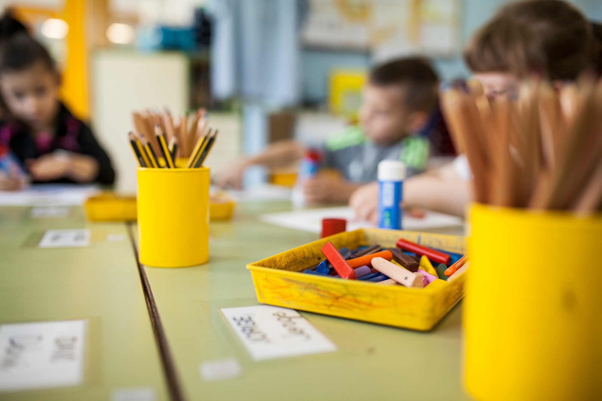 children making a drawing with paintings