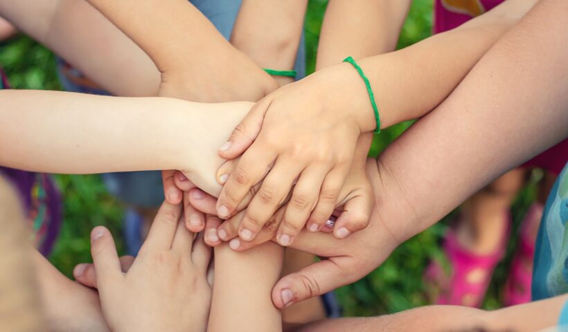 Children's hands together, street games. Selective focus.