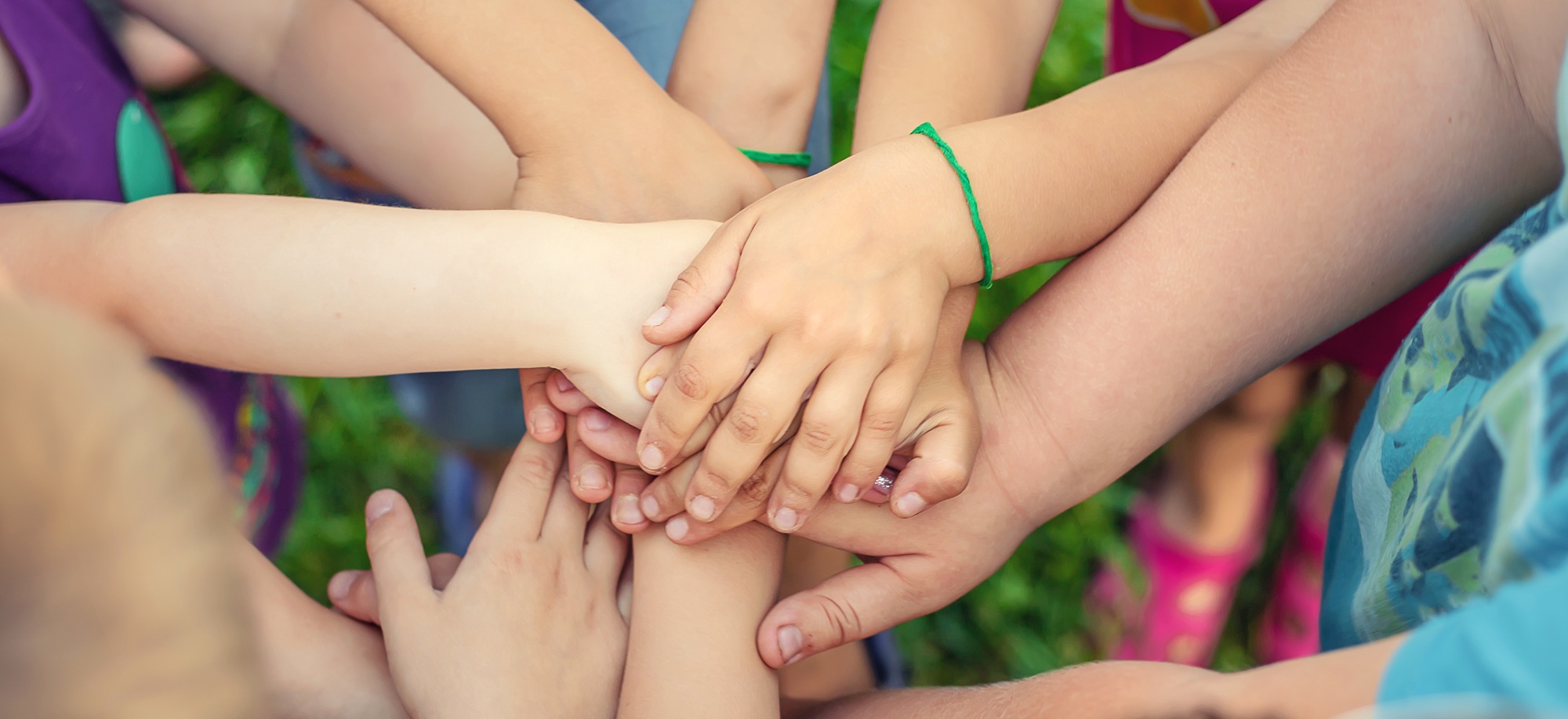 Children's hands together, street games. Selective focus.