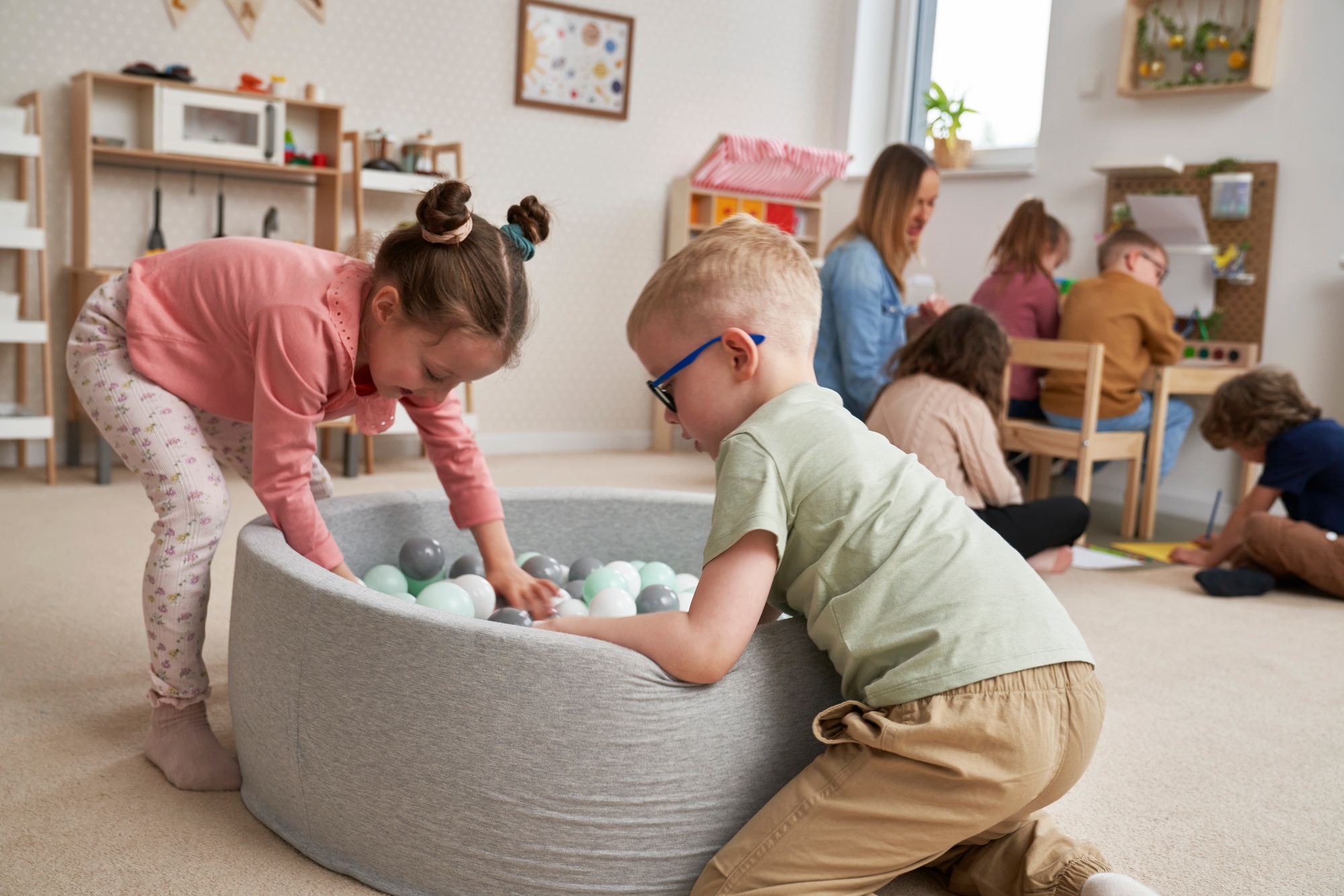 Children playing together in the kindergarten