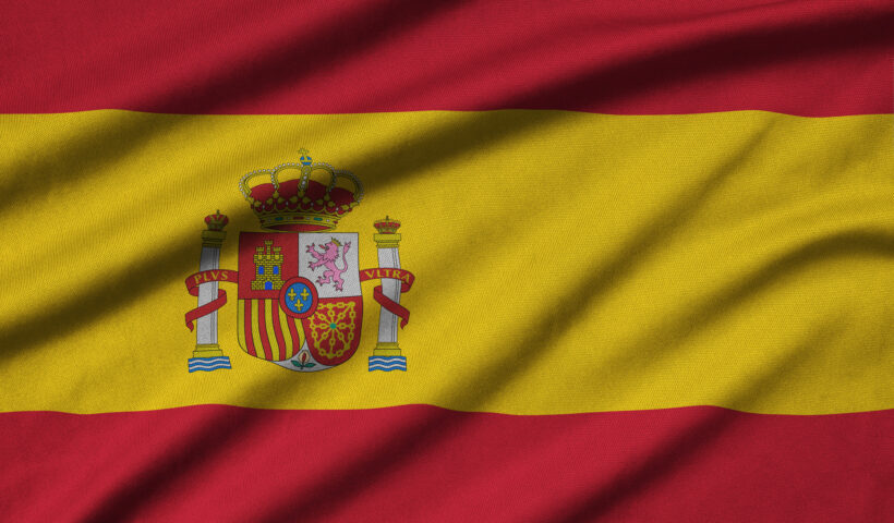 Spain flag is depicted on a sports cloth fabric with many folds. Sport team waving banner