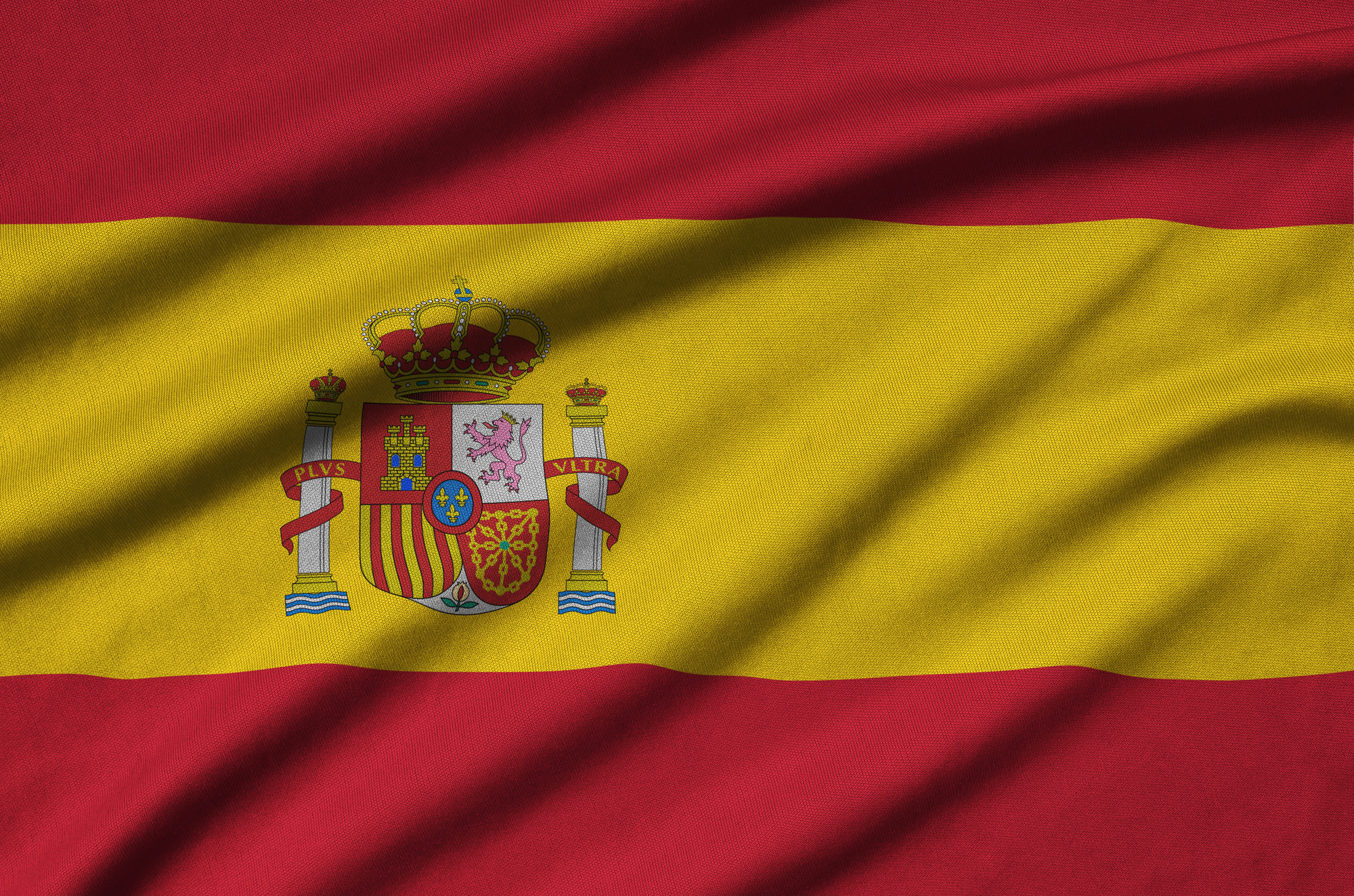 Spain flag is depicted on a sports cloth fabric with many folds. Sport team waving banner